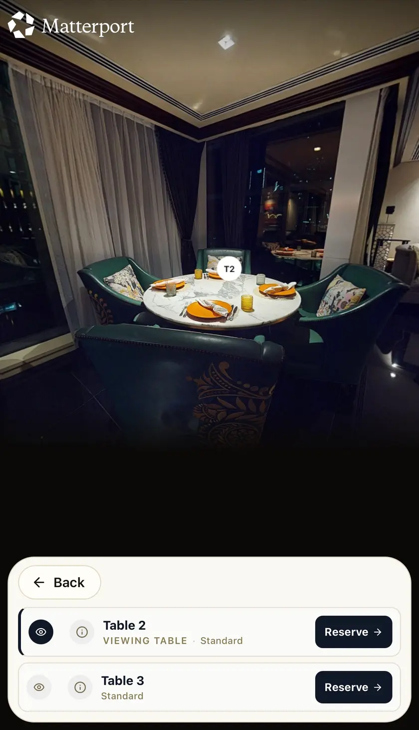 A guest browsing a venue's real 3D room in Pick Your Spot and selecting Table 2, a viewing table.